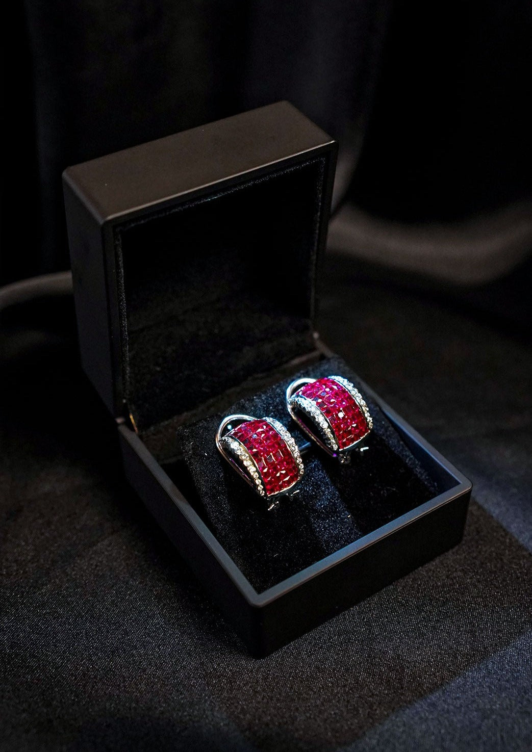 The Mystery Setting Ruby Hoops